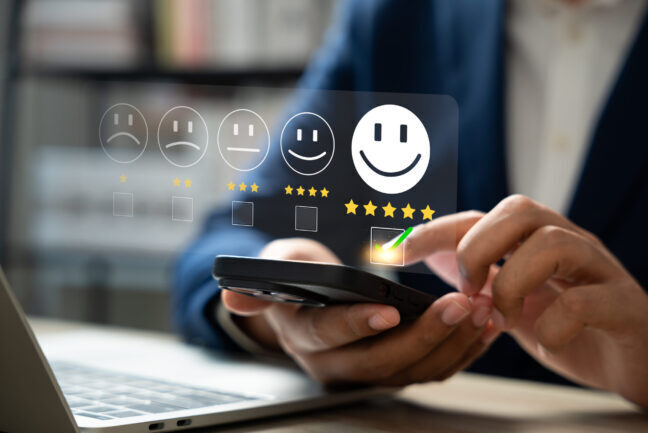 customer-satisfaction-survey-concept-businessman-using-smartphone-touch-happy-smiley-icon-5-star-service-experience-rating-feedback-online-review-online-application-quality-satisfaction-review